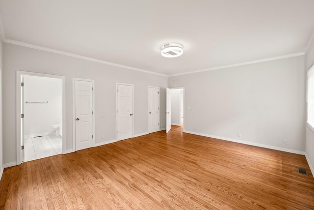 314 Avondale Ct, Cookeville, TN 38506 - unfurnished bedroom with crown molding, light wood finished floors, two closets, baseboards, and ensuite bathroom