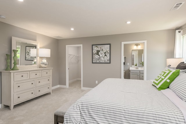 1171 Savannah Ave, Gallatin, TN 37066 - bedroom featuring light carpet, a walk in closet, recessed lighting, ensuite bathroom, and baseboards