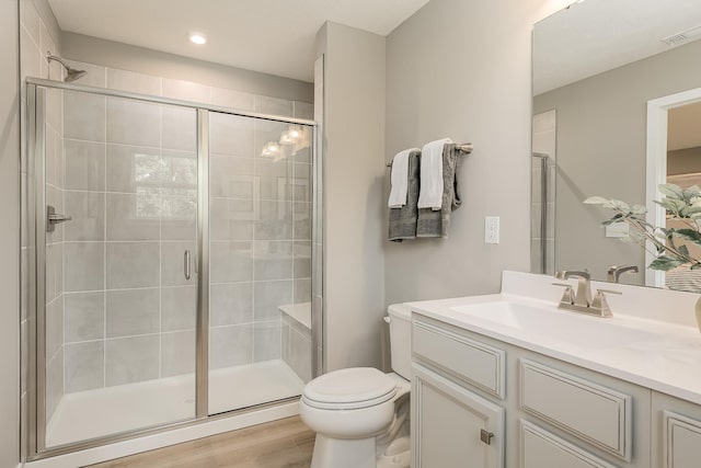1171 Savannah Ave, Gallatin, TN 37066 - bathroom with toilet, vanity, a shower stall, wood finished floors, and recessed lighting