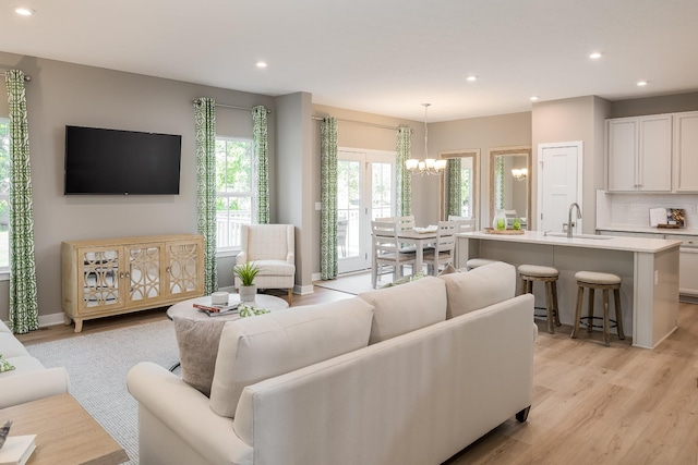 1171 Savannah Ave, Gallatin, TN 37066 - living area featuring a chandelier, light wood finished floors, and recessed lighting