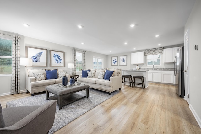 1296 Laurel St, Gallatin, TN 37066 - living area featuring light wood-style flooring, recessed lighting, and baseboards