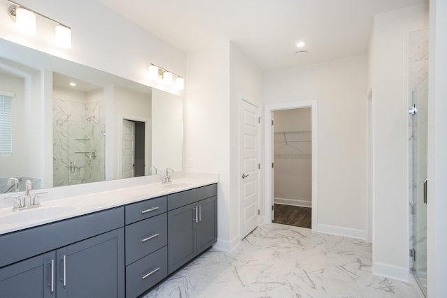 3013 Kemp Dr, Hermitage, TN 37076 - bathroom with a marble finish shower, double vanity, a spacious closet, marble finish floors, and baseboards