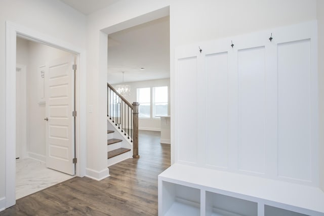 3013 Kemp Dr, Hermitage, TN 37076 - mudroom featuring a chandelier, baseboards, and wood finished floors