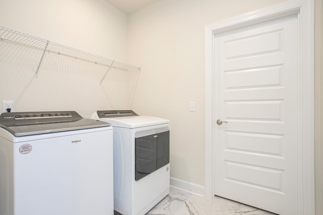 3013 Kemp Dr, Hermitage, TN 37076 - laundry area featuring washing machine and clothes dryer, light marble finish flooring, and baseboards