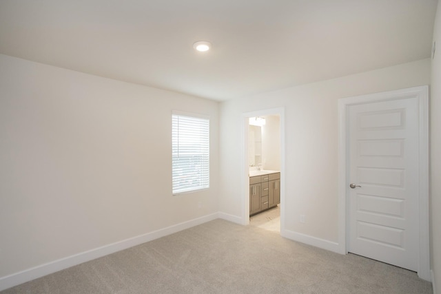 3013 Kemp Dr, Hermitage, TN 37076 - unfurnished bedroom featuring light colored carpet, baseboards, and ensuite bathroom