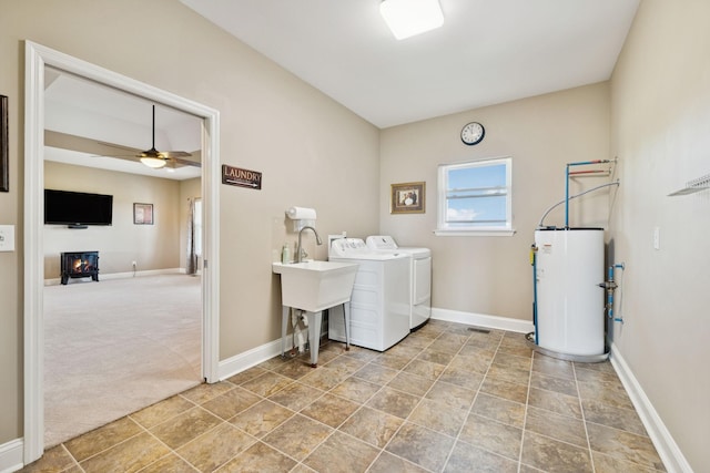 930 Eastover Rd, Lebanon, TN 37090 - laundry room with water heater, washer and dryer, baseboards, ceiling fan, and stone finish floors
