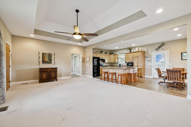 930 Eastover Rd, Lebanon, TN 37090 - living room featuring recessed lighting, light carpet, a ceiling fan, a raised ceiling, and baseboards