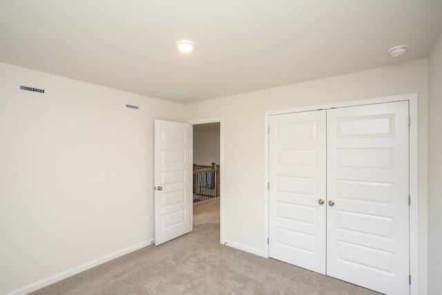 3263 Kemp Dr, Hermitage, TN 37076 - unfurnished bedroom featuring light colored carpet, baseboards, and a closet