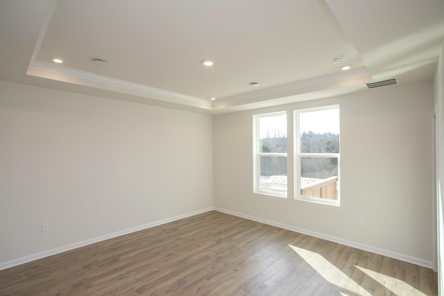 3263 Kemp Dr, Hermitage, TN 37076 - unfurnished room with a raised ceiling, crown molding, baseboards, wood finished floors, and recessed lighting