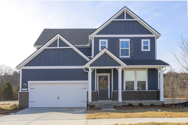 3263 Kemp Dr, Hermitage, TN 37076 - craftsman-style house featuring concrete driveway, covered porch, a garage, board and batten siding, and roof with shingles