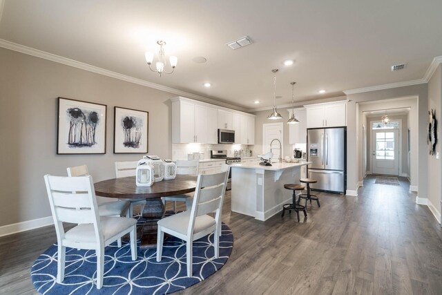 2550 Ashford Dr, Mount Juliet, TN 37122 - dining space with baseboards, crown molding, dark wood-style floors, a chandelier, and recessed lighting