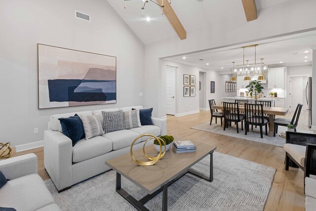2521 Kingston Ct, Mount Juliet, TN 37122 - living area featuring light wood-type flooring, recessed lighting, a chandelier, baseboards, and beamed ceiling