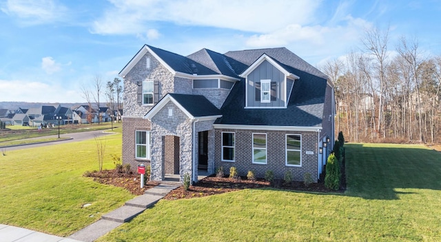 2521 Kingston Ct, Mount Juliet, TN 37122 - view of front of property featuring a front yard, stone siding, board and batten siding, and brick siding