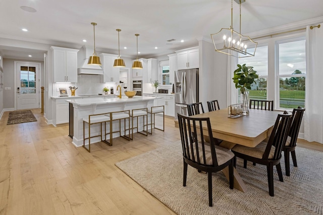 2521 Kingston Ct, Mount Juliet, TN 37122 - dining space featuring light wood-style flooring, ornamental molding, recessed lighting, a chandelier, and baseboards