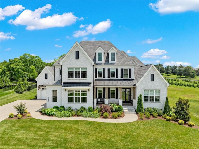 1750 Barrow Ln, Brentwood, TN 37027 - view of front of property featuring covered porch, a front lawn, a standing seam roof, concrete driveway, and brick siding