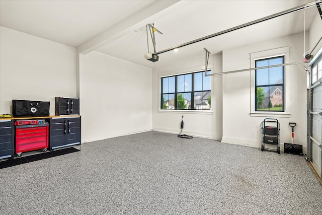 1750 Barrow Ln, Brentwood, TN 37027 - garage featuring baseboards and a garage door opener