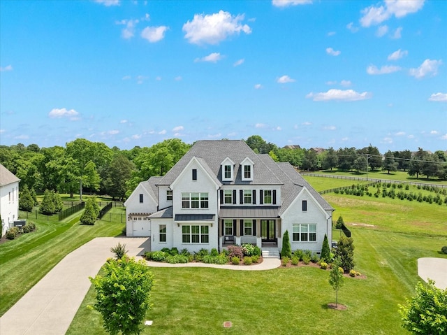 1750 Barrow Ln, Brentwood, TN 37027 - view of front of home featuring covered porch, a garage, a standing seam roof, concrete driveway, and metal roof