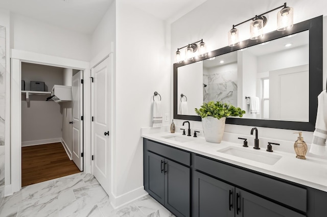 1005 Cherry Tree Dr, Mount Juliet, TN 37122 - bathroom with double vanity, marble look tiles, baseboards, a closet, and a marble finish shower