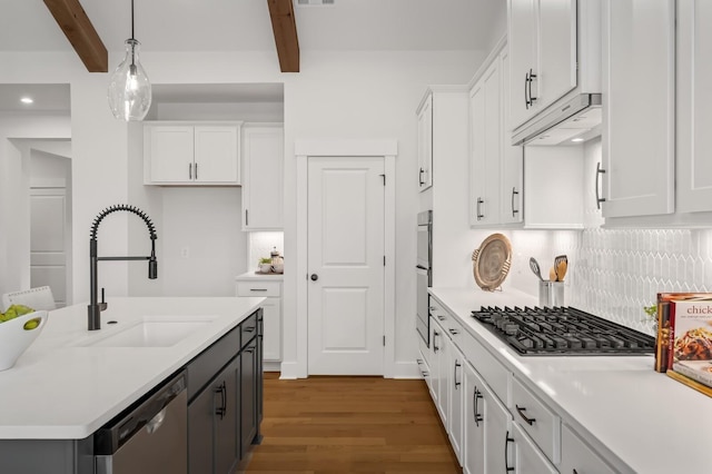 1005 Cherry Tree Dr, Mount Juliet, TN 37122 - kitchen featuring appliances with stainless steel finishes, a sink, wood finished floors, beam ceiling, and white cabinets