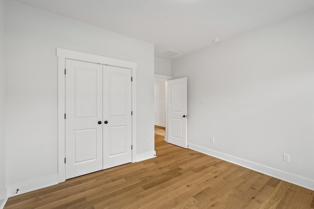 1005 Cherry Tree Dr, Mount Juliet, TN 37122 - unfurnished bedroom with light wood-type flooring, baseboards, and a closet