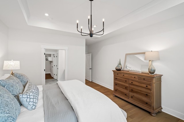 1005 Cherry Tree Dr, Mount Juliet, TN 37122 - bedroom featuring a chandelier, a tray ceiling, wood finished floors, baseboards, and recessed lighting