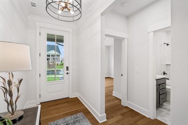 1005 Cherry Tree Dr, Mount Juliet, TN 37122 - foyer entrance featuring a chandelier, wood finished floors, and baseboards