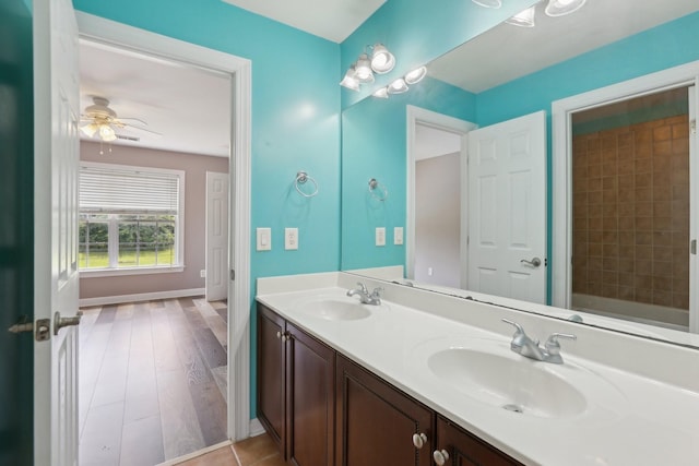 102 Oglethorpe Ave, Gallatin, TN 37066 - bathroom with double vanity, a ceiling fan, baseboards, and wood finished floors