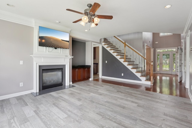 102 Oglethorpe Ave, Gallatin, TN 37066 - unfurnished living room featuring stairway, a ceiling fan, recessed lighting, wood finished floors, and a large fireplace