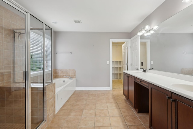 102 Oglethorpe Ave, Gallatin, TN 37066 - full bathroom with a garden tub, a stall shower, double vanity, tile patterned floors, and baseboards