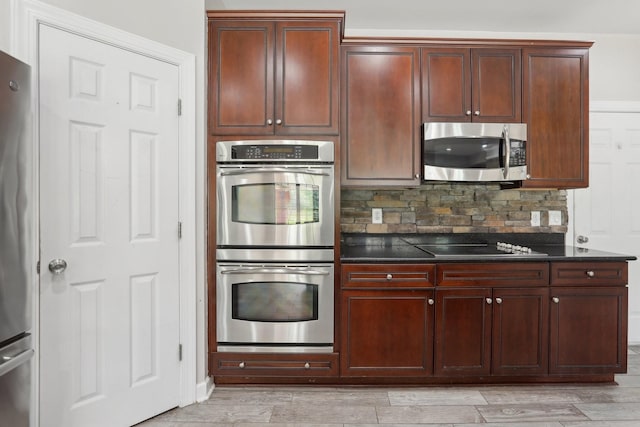 102 Oglethorpe Ave, Gallatin, TN 37066 - kitchen featuring stainless steel appliances, tasteful backsplash, and light wood finished floors