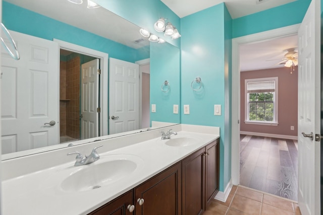 102 Oglethorpe Ave, Gallatin, TN 37066 - full bathroom featuring double vanity, baseboards, ceiling fan, tile patterned flooring, and a tub
