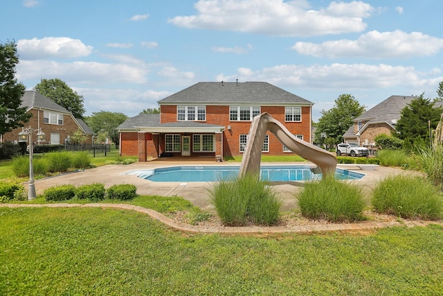 102 Oglethorpe Ave, Gallatin, TN 37066 - rear view of house with brick siding, an outdoor pool, french doors, and a patio