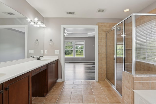 102 Oglethorpe Ave, Gallatin, TN 37066 - bathroom featuring double vanity, a shower stall, tile patterned flooring, ceiling fan, and recessed lighting