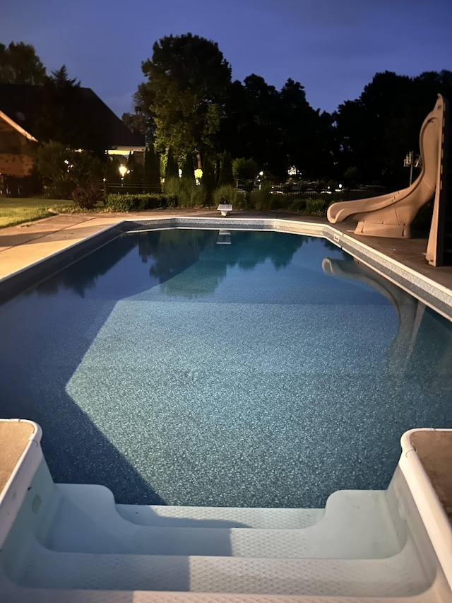 102 Oglethorpe Ave, Gallatin, TN 37066 - pool at twilight featuring a water slide and an outdoor pool
