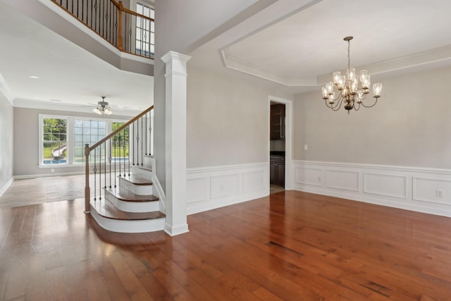 102 Oglethorpe Ave, Gallatin, TN 37066 - empty room with stairs, wood-type flooring, a chandelier, ornamental molding, and a ceiling fan