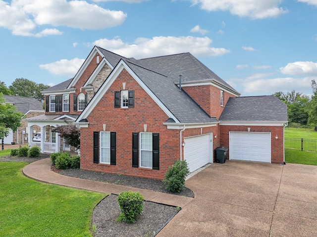 102 Oglethorpe Ave, Gallatin, TN 37066 - view of front of property with a garage, concrete driveway, brick siding, and a shingled roof