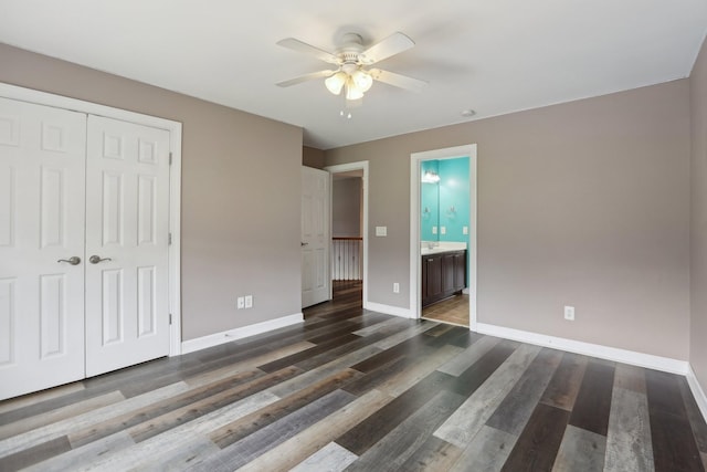 102 Oglethorpe Ave, Gallatin, TN 37066 - unfurnished bedroom with baseboards, a closet, dark wood-style floors, ensuite bath, and a ceiling fan