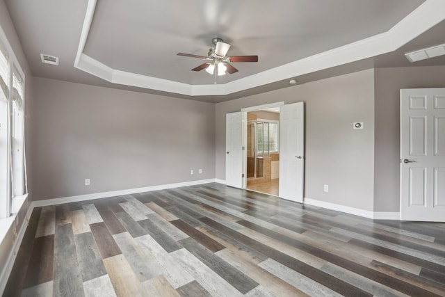 102 Oglethorpe Ave, Gallatin, TN 37066 - empty room featuring a tray ceiling, ceiling fan, wood finished floors, and baseboards