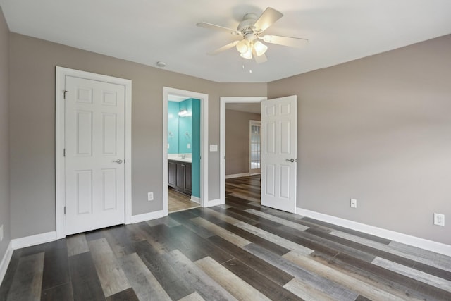 102 Oglethorpe Ave, Gallatin, TN 37066 - unfurnished bedroom featuring baseboards, dark wood finished floors, ensuite bath, and a ceiling fan