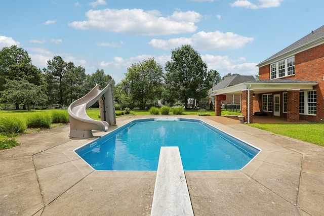 102 Oglethorpe Ave, Gallatin, TN 37066 - swimming pool featuring a water slide, a diving board, a patio, and a lawn