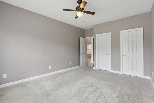 102 Oglethorpe Ave, Gallatin, TN 37066 - unfurnished bedroom featuring light colored carpet, baseboards, and ceiling fan