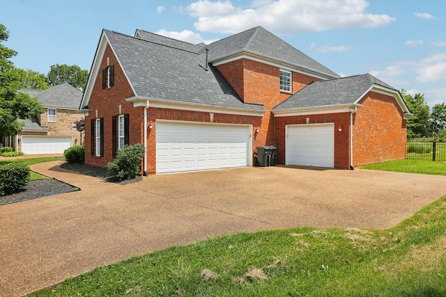 102 Oglethorpe Ave, Gallatin, TN 37066 - view of property exterior featuring brick siding, driveway, a shingled roof, and an attached garage