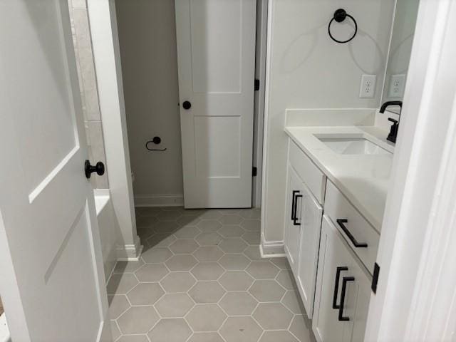 1320 Ashton Park Dr, Mount Juliet, TN 37122 - bathroom featuring vanity, tile patterned floors, a tub, and baseboards