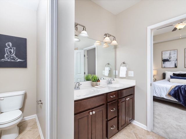2438 Arden Village Dr, Columbia, TN 38401 - ensuite bathroom featuring double vanity, tile patterned floors, toilet, and baseboards