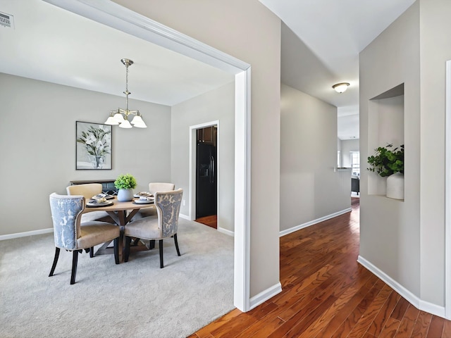 2438 Arden Village Dr, Columbia, TN 38401 - dining space with a chandelier, baseboards, and wood finished floors