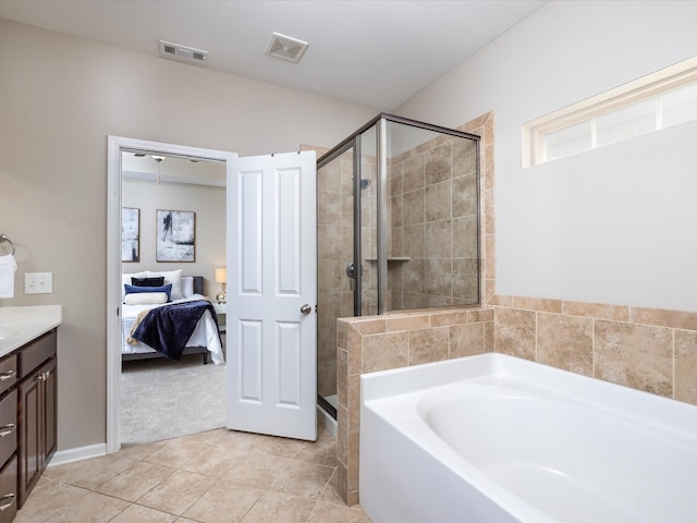 2438 Arden Village Dr, Columbia, TN 38401 - full bathroom featuring connected bathroom, a bath, a stall shower, vanity, and tile patterned floors