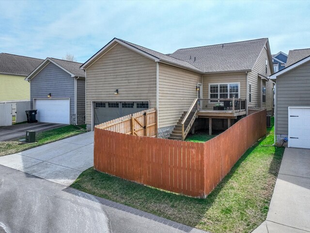 2438 Arden Village Dr, Columbia, TN 38401 - rear view of property featuring concrete driveway, stairs, a deck, and a garage