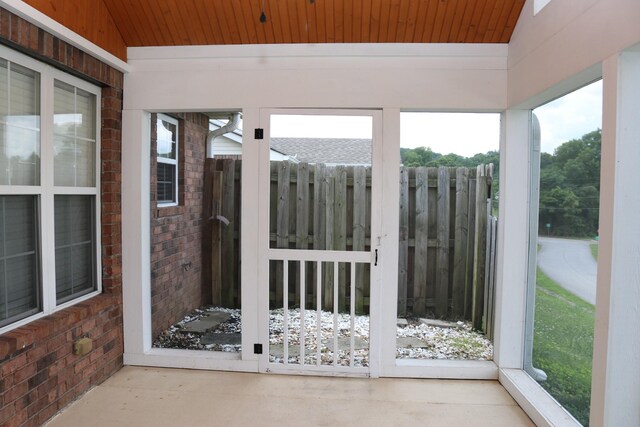 1321 Crofton Park Dr, Columbia, TN 38401 - unfurnished sunroom with wooden ceiling and brick wall
