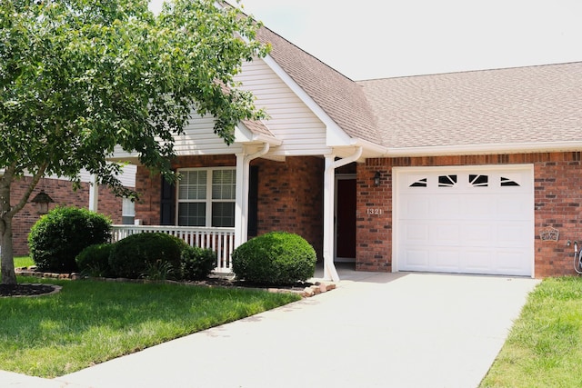 1321 Crofton Park Dr, Columbia, TN 38401 - view of front of property with concrete driveway, an attached garage, brick siding, and a porch
