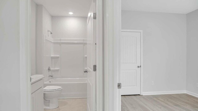6454 Japonica Ln, White House, TN 37188 - full bath with toilet,  shower combination, vanity, wood finished floors, and baseboards